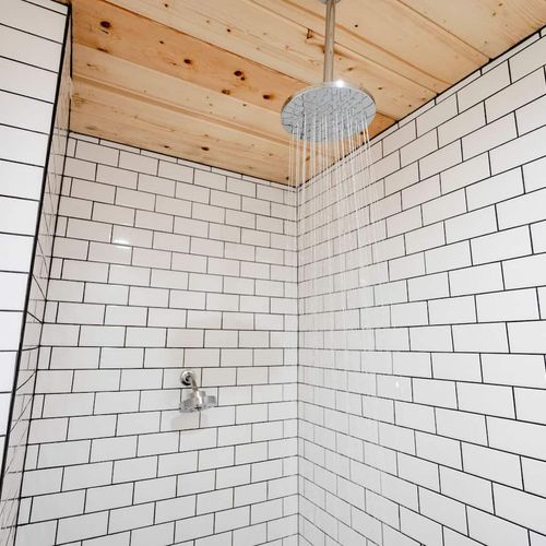 Beautiful walk-in shower with rain head.