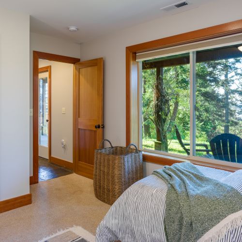 Cozy bedroom just steps from the patio, offering easy outdoor access for fresh air and relaxation.