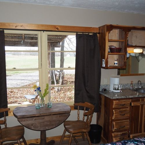 Main room:  the little sink / kitchenette and breakfast table that is in the main room.
