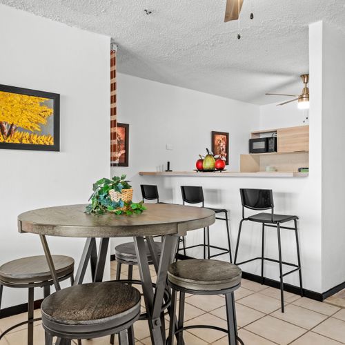 Our kitchen bar area is the ideal spot for casual dining or catching up over a cup of coffee.