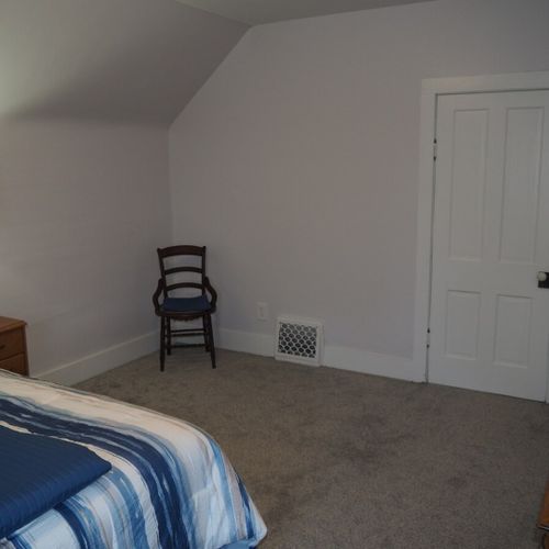 Bedroom #1:  all 3 bedrooms are upstairs. This bedroom features a queen-size bed, nightstands with lamps, dresser, chair, and a large closet.