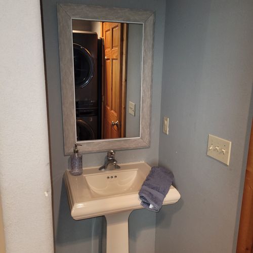 BATHROOM #2 (MAIN FLOOR):  This is a full common bathroom on the main floor with a walk-in shower.  Also has a stacked washer and dryer in it.