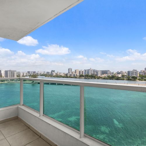Be captivated by endless turquoise waters stretching to the horizon, with the vibrant city nestled along the shore.