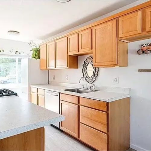 Fresh mornings start here—light, space, and charm fill this well appointed kitchen.