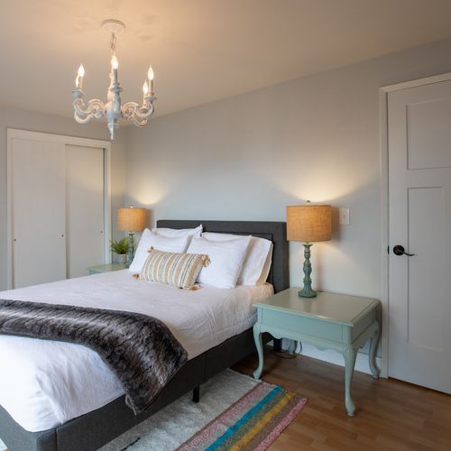 Master bedroom with queen bed and two large closets.