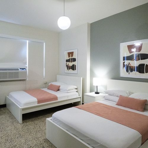 Settle into a peaceful night's sleep in this tranquil bedroom. The soft lighting and comfortable bedding are perfect for unwinding and recharging.