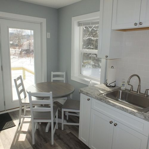 Kitchen:  another angle highlighting the kitchen sink and the dining table
