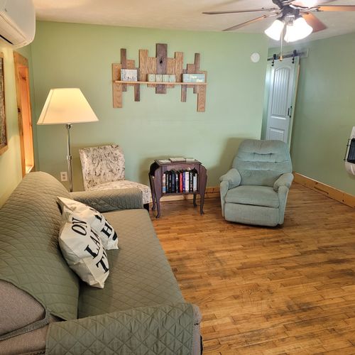 Living room:  the living room with the ceiling fan on the top