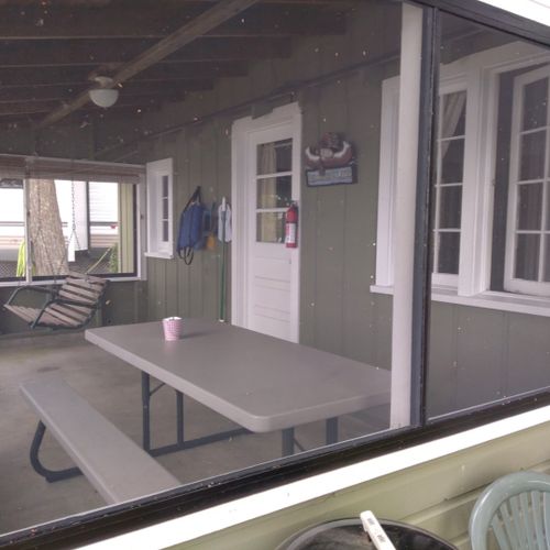 Front porch:  the cabin has a lovely screened-in porch with a picnic table and a great view of little platte lake