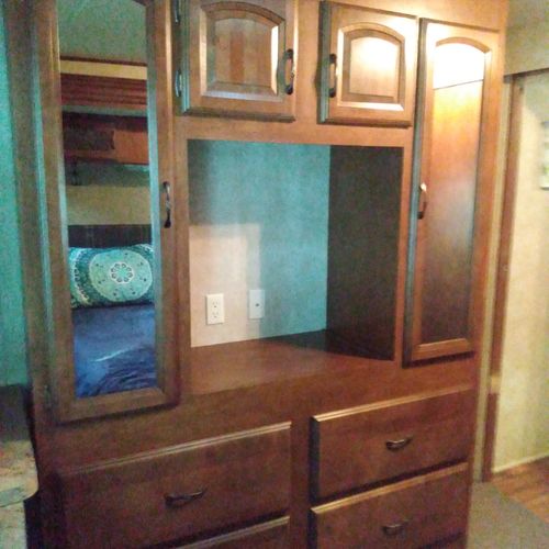 Bedroom #1:  features a queen-size bed, dresser, and a great view of little platte lake.