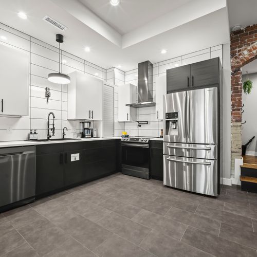 Fully equipped kitchen with large island and modern finishes.