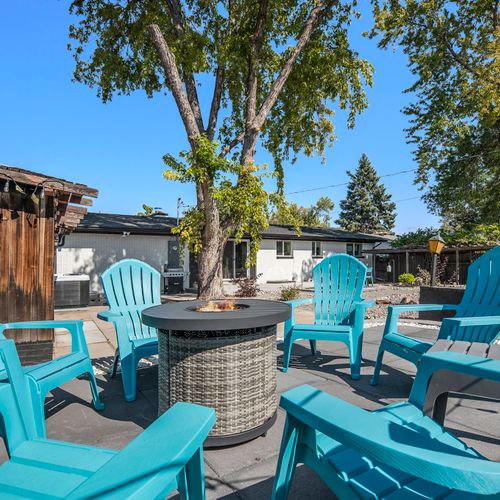 Gather around the fire pit in cozy adirondack chairs, the perfect setting for roasting marshmallows and sharing stories over delicious s'mores!