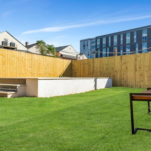 Fenced pool w/ a city backdrop — privacy meets a one-of-a-kind setting.