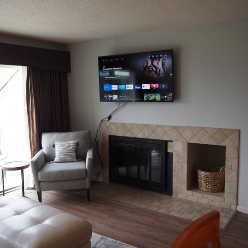 Living room:  features a sofa, comfy chair, ottoman, large screen television, and a desk and chair. (note that guest usage of the fireplace in the living room is strictly prohibited. )