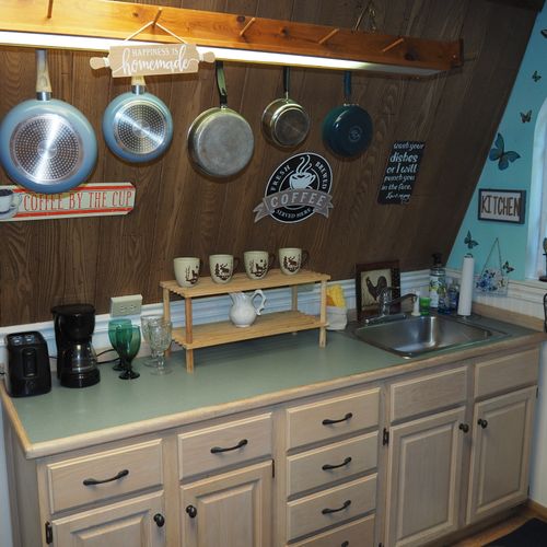 Kitchen:  full kitchen including sink, counter, cabinets, refrigerator, electric range and a good supply of cooking and dining utensils.