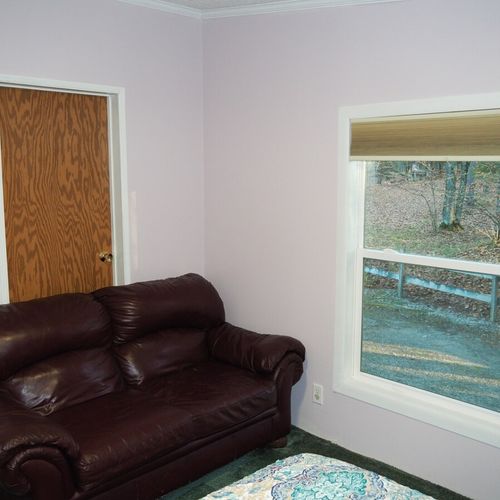 Bedroom #3:  the sofa in the bedroom and the bedroom window, which faces the side of the house. Note that the closet that is shown is used for storage and is not available for guest usage.