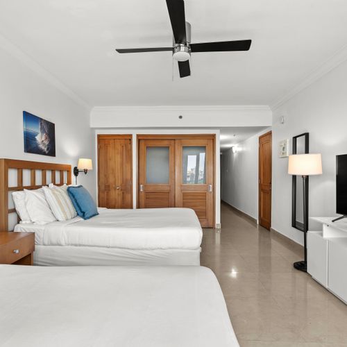 Bright and airy studio with two comfortable beds and stunning views through balcony doors.