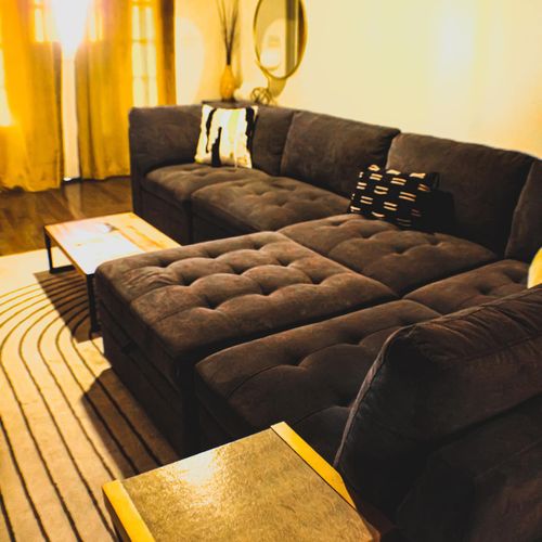 Plush, tufted sectional sofa that pulls you in for a long, lazy afternoon.