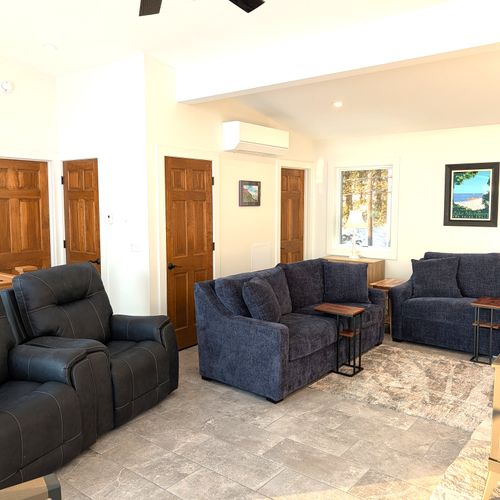 LIVING ROOM (UPPER LEVEL):  The home has an exquisite living room on the upper level (third floor) with a spectacular view of Crystal Lake!  PLEASE NOTE THAT THE FIREPLACE IS NOT AVAILABLE FOR GUEST USAGE.