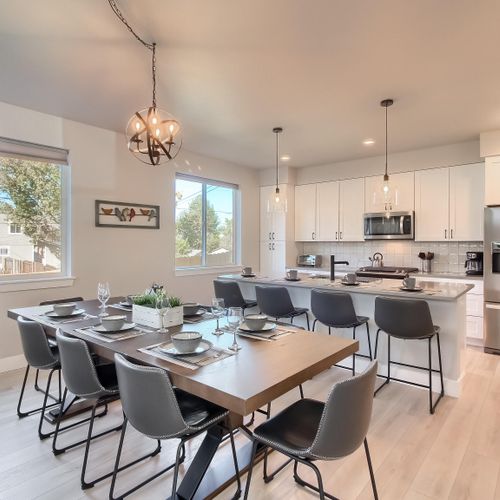 - spacious kitchen includes quartz countertops, full appliances, and seating for four