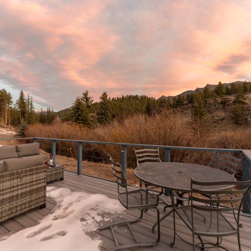 Step out onto the deck and take in serene views of the trees and the nearby river, just a short walk away.