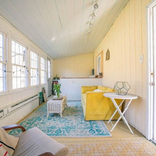 Through the door to the left of the entryway is the four seasons room