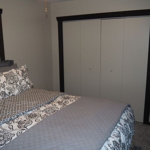 Bedroom #1 (main floor):  features a king-size bed, ceiling fan, dresser, mirror, closet, and a private television with live streaming via roku.