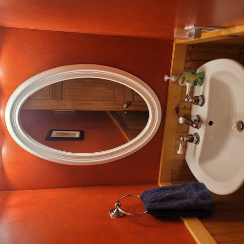 Bathroom #1 (main floor):  cute half-bath with sink, mirror, and toilet on the main floor.