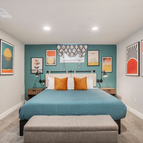 This generously sized downstairs third bedroom showcases the meticulous attention to detail throughout the space, creating a stylish and inviting atmosphere.