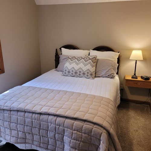 BEDROOM #3 (SECOND FLOOR):  Comfy bed with a queen-size bed, nightstand, and closet.
