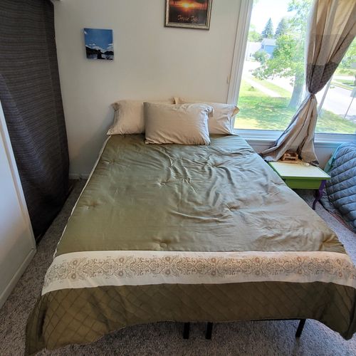 Bedroom #2 ( second floor):  features a full-size bed, a twin bed, a ceiling fan, and a closet.