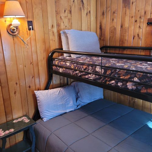 Bedroom #2:  features a twin-on-full bunk bed, which allows 3 people to sleep in the room. Also includes a dresser and mirror.