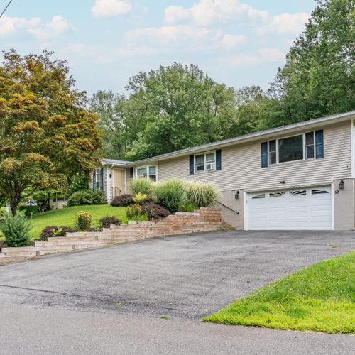 The front of the house offers ample parking for your guests. Don’t forget to say hello to our beautiful maple tree gracing the front lawn!