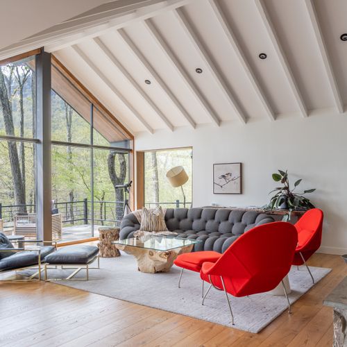 Cathedral ceilings and wall-to-wall windows create a breathtaking and dramatic atmosphere.