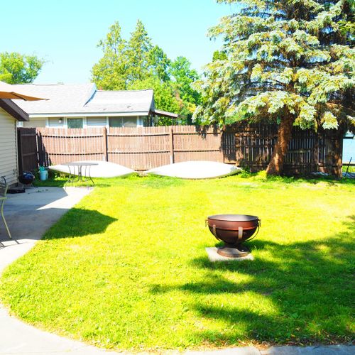 Exterior:  the backyard in the summer. (note the 2 kayaks that are provided with the rental. )