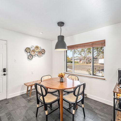 Cozy breakfast nook with natural light, perfect for enjoying your morning coffee or casual meals.