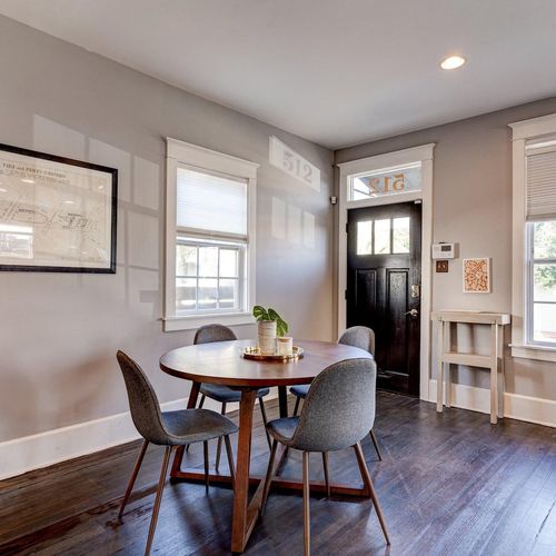 Airy dining nook bathed in natural light — a lovely spot to share a meal.