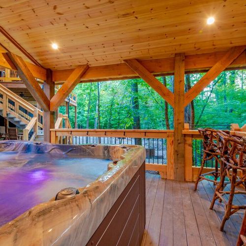 An oversized hot tub and additional seating can be found in the gazebo.