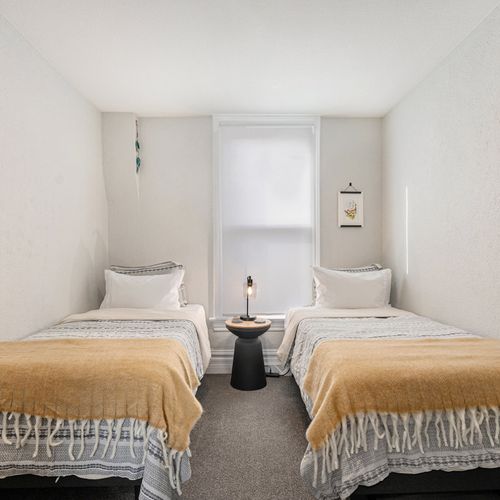 Our second bedroom features two stylish and comfortable twin beds