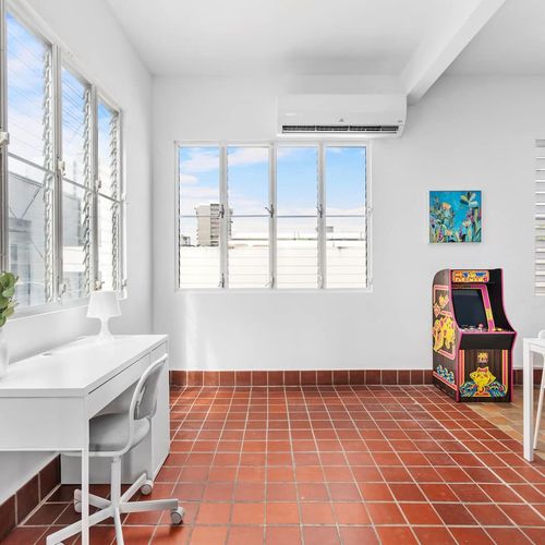 Perfect room for relaxing or working  with our unique space featuring an arcade machine.