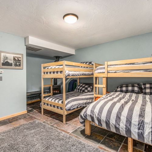 - view another angle of this inviting bunk room designed for group or family stays