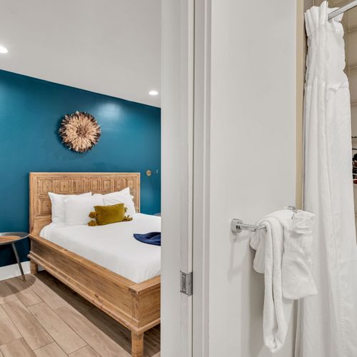 Enjoy easy access to a clean, modern bathroom with plush towels and a bright, polished finish—ideal for refreshing and recharging.