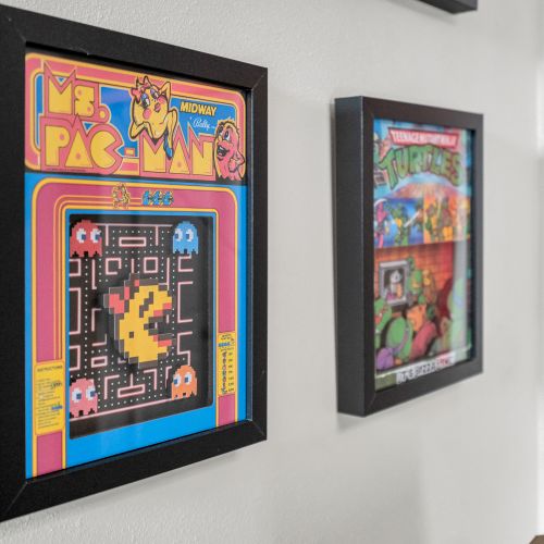 Retro Pac-Man wall art adding a playful, nostalgic touch to the space.