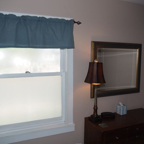 Bedroom #1:  features a queen-size bed, nightstand, lamp, dresser, mirror, closet, and television.