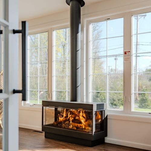 This gas fireplace fills the sun room with warmth and creates a cozy ambience immediately upon stepping into the home.