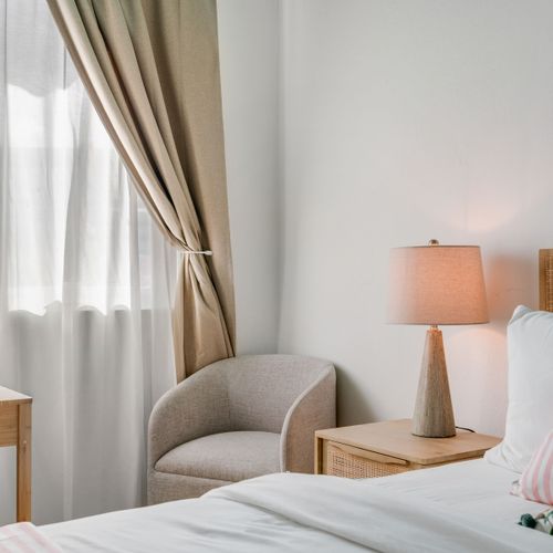 A cozy bedroom with a clean design and a great bed.