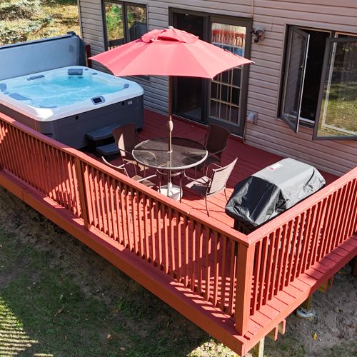 OVERVIEW:   Aerial view highlighting the new hot tub, outdoor dining furniture, and new gas grill.