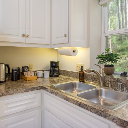 The Apartment: Coffee bar with a full kitchen for private meals.