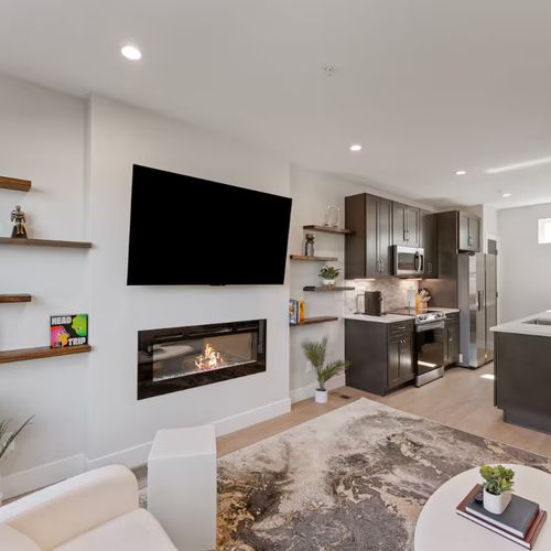 Artful decor, plush seating, and thoughtful design make this welcoming space the heart of the home.