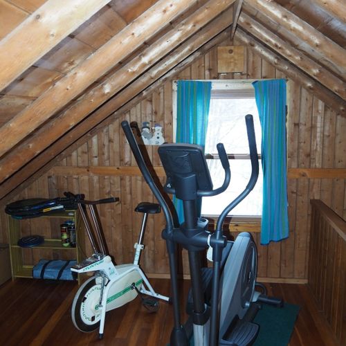 Loft area:  there is a large upstairs loft with a full-size bed, a twin bed, and some older exercise equipment that is available for guests to use.